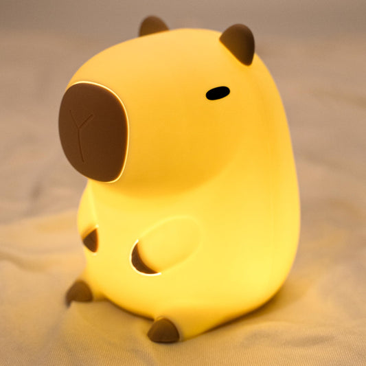 Cute capybara-shaped LED lamp illuminating a nursery.