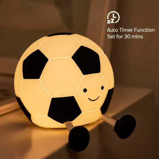 Cozy football night light glowing softly in a nursery.